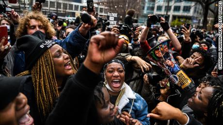 People celebrate outside the Hennepin County Government Center in Minneapolis on April 20, 2021, as the verdict is announced in the trial of former police officer Derek Chauvin.