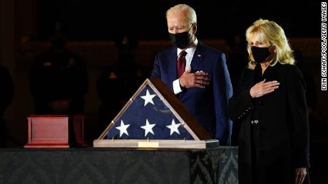 The first lady and President Joe Biden pay their respects to US Capitol officer Brian D. Sicknick as he lies in honor in the US Capitol in February.