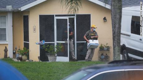 FBI agents remove possible evidence Tuesday from the family home of Brian Laundrie in North Port, Florida.