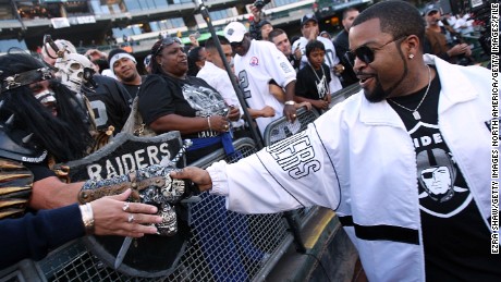 Rapper-actor Ice Cube greets Oakland Raiders fans before a game on September 14, 2009, at the Oakland-Alameda County Coliseum.