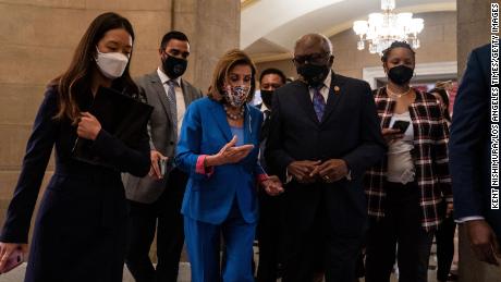 Pelosi walks with Majority Whip James Clyburn, right, who told CNN he's not interested in becoming speaker. 