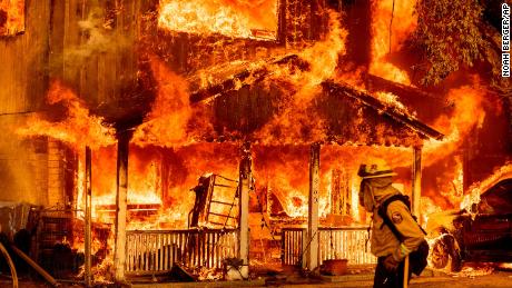 A home is engulfed in flames as the Beckwourth Complex Fire tears through Doyle, California, on July 10, 2021. 
