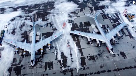 A pair of Tu-95 strategic bombers are parked at an air base in Engels, near the Volga River in Russia, on January 24, 2022, in an image taken from video provided by the Russian Defense Ministry.