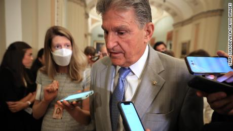 Sen. Joe Manchin talks to reporters as he leaves the the Senate Democrats weekly policy luncheon at the U.S. Capitol in July 2021 in Washington, DC. 